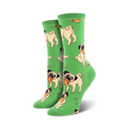 Pair of crew socks featuring light beige pugs enjoying pizza slices on a bright green background.