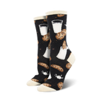 Lifestyle shot of a person wearing the black 'Mmm Cookies' socks; black socks with cookie and milk design.