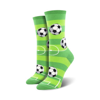 green soccer field patterned women's crew socks with 3 soccer ball graphics. 