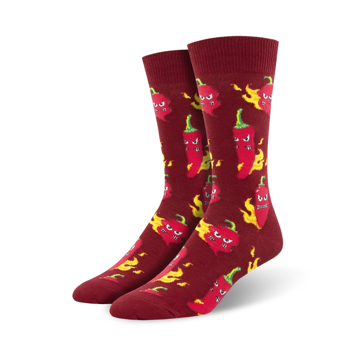 mens red crew socks feature an all-over pattern of cartoon chili peppers with flame-like hair.  