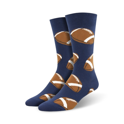 blue crew socks with brown footballs, white stripes, and laces. fall theme, perfect for men.  