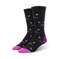 Pair of black crew socks with a repeating pattern of purple cat eyes and whiskers.  Pink accents at the toe and heel.
