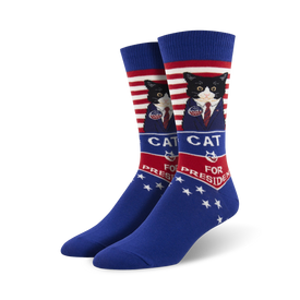 blue socks with red and white stripes feature a cat in a suit and tie running for president.  