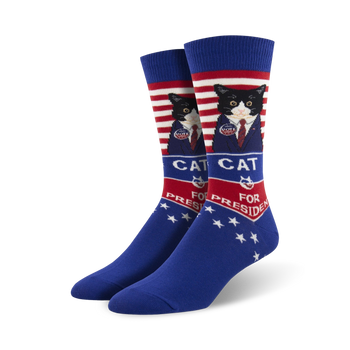 blue socks with red and white stripes feature a cat in a suit and tie running for president.  