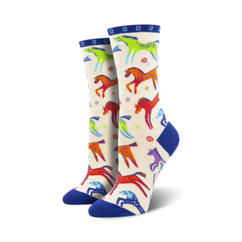 womens dancing horses crew socks. vibrant horses pattern with blue toe, heel and band.  