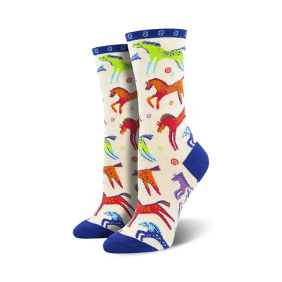 womens dancing horses crew socks. vibrant horses pattern with blue toe, heel and band.  