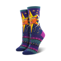 Pair of women's crew socks. Deep purple background with a whimsical sun and moon design. Colorful Southwestern-inspired pattern at the bottom.