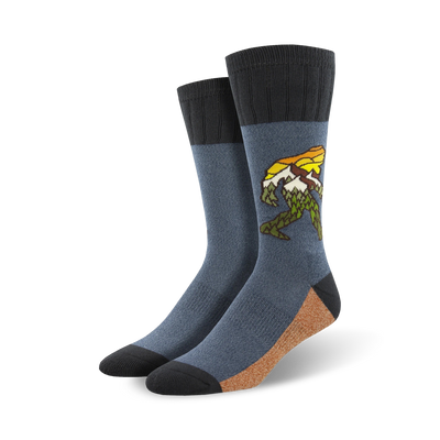 dark blue, brown, and black cotton crew socks featuring green and yellow bigfoot carrying sunset.  