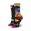 Women's crew socks in black with a colorful rainbow, sun, moon, and stars design. Pink heel and toe.
