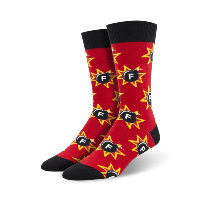 red crew socks with a pattern of black bombs; yellow stars and "f". black toe and heel. funny socks for men.   