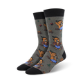 Pair of crew socks; grey background with repeating pattern of beavers wielding axes.  Beavers are brown and blue; black cuffs.
