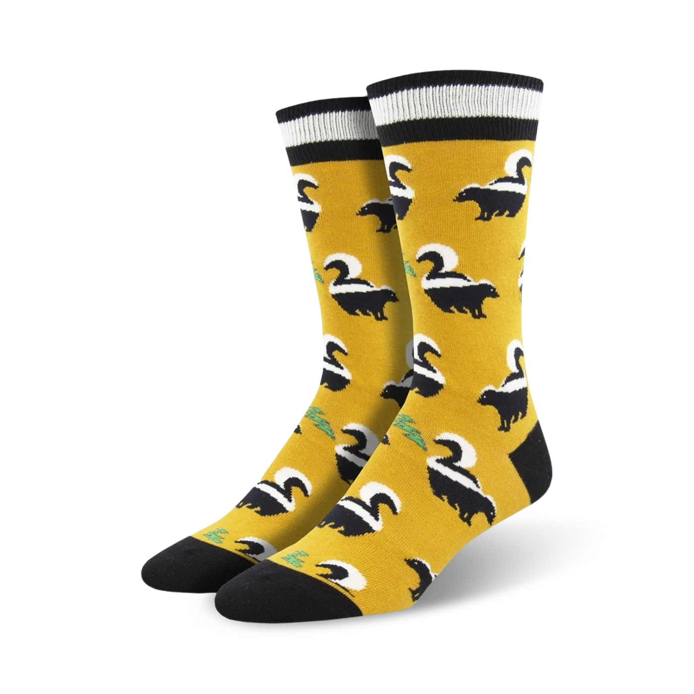 Pair of mustard yellow crew socks with a black skunk pattern.  Features black and white stripes at the top.