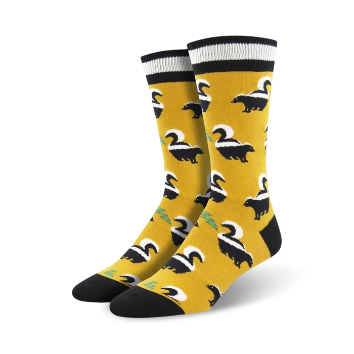 funky skunky socks: bright yellow with black skunks, white stripes, green tails; black toe, heel, white band at top. men's crew socks.  