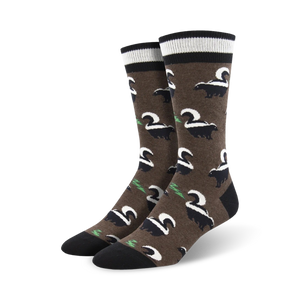 cartoony black and white skunks cover these brown crew socks, designed for men, for a humorous and interesting design.   