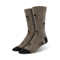 A pair of taupe crew socks with a repeating pattern of colorful tarantulas.  The socks have black toes and heels.