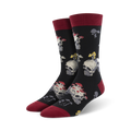 Pair of black crew socks with a fun design. Skulls are topped with red and white mushrooms. The socks have burgundy cuffs.