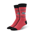 A pair of red crew socks with a black cuff, featuring a possum graphic and 'Awesome Possum' text in a pixelated font.