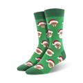 Pair of crew socks, green and white, featuring a repeating pattern of a Black Santa Claus wearing a red hat.