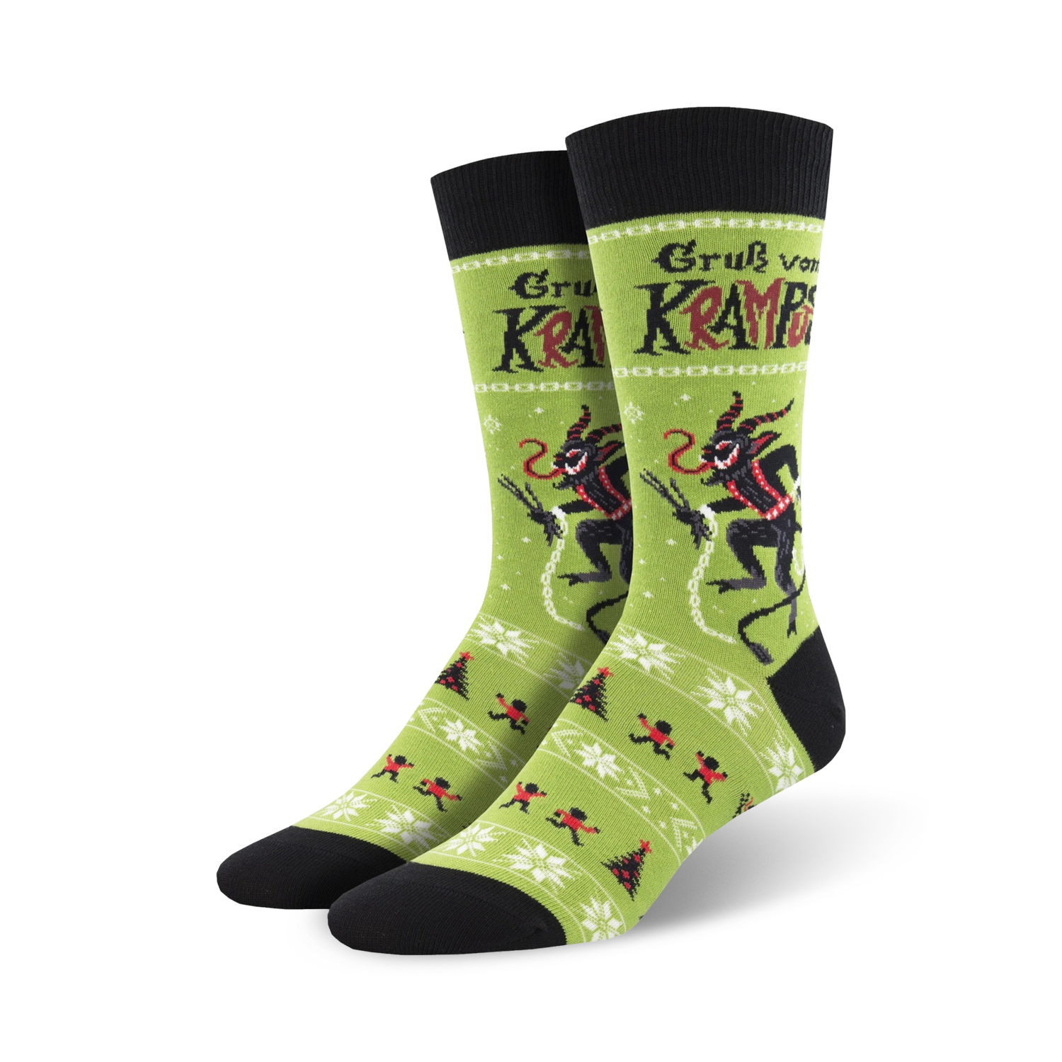 A pair of crew socks in green and black, showcasing a playful Krampus design alongside a festive winter pattern. 