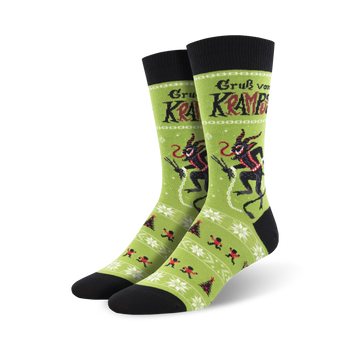  green krampus crew socks with christmas tree and snowflake pattern for men.   
