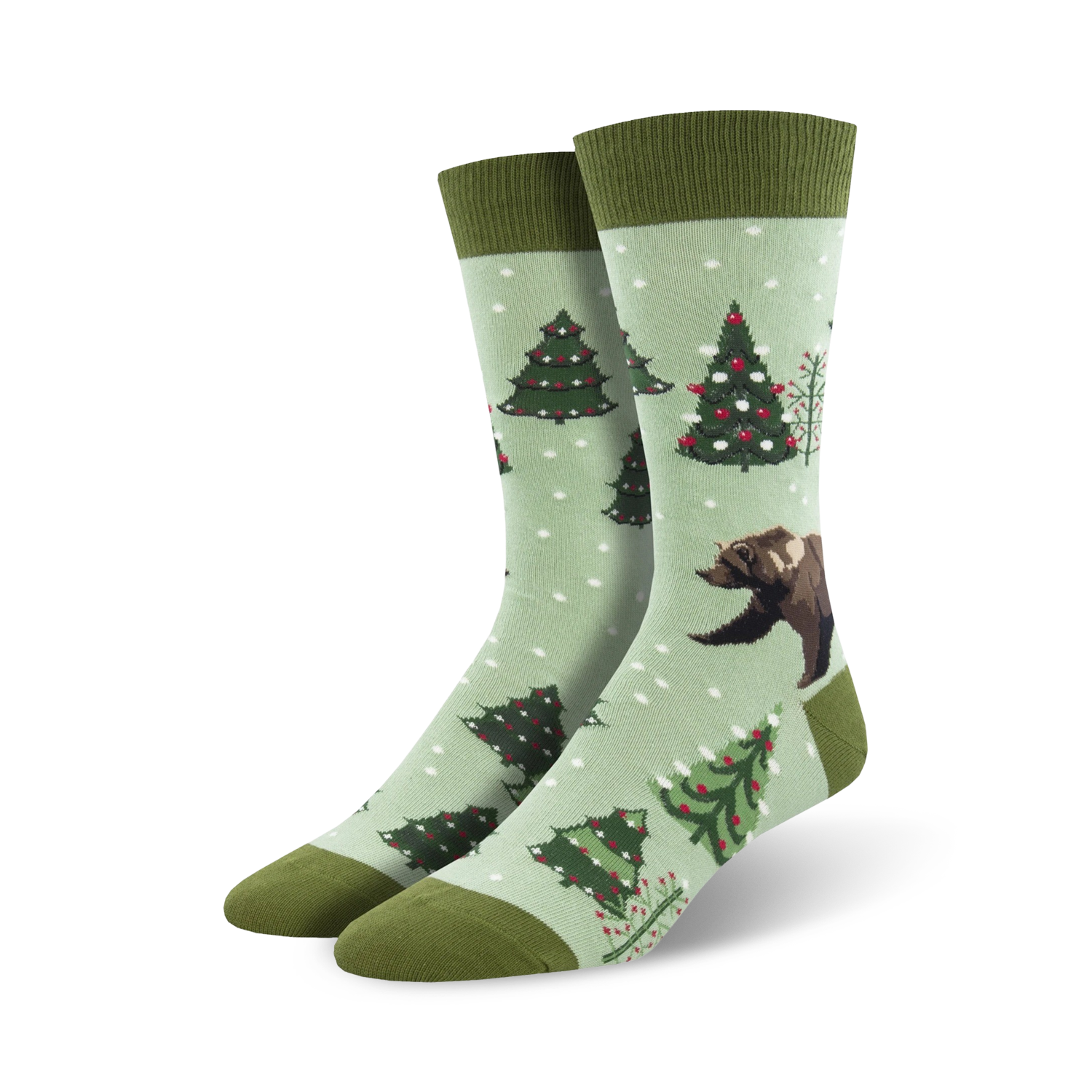 Pair of crew socks; light green background, dark green cuffs; features decorated Christmas trees and a brown bear.