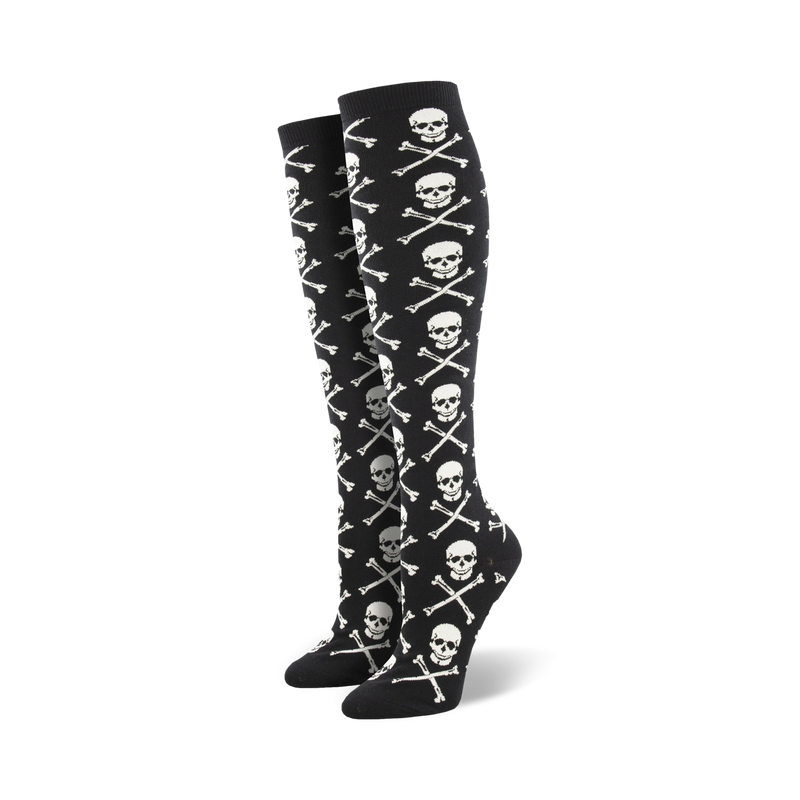 Pair of black knee-high socks with a repeating pattern of white skulls and crossbones.