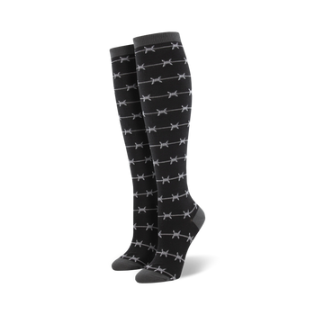 show your funky side with these black crew socks featuring a barbed wire pattern in fierce black and white - perfect for the edgy dresser.    