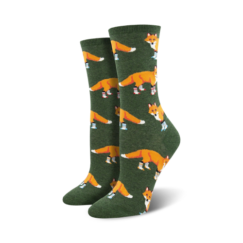 Lifestyle shot of Socksy Foxes socks on a woman's feet, showing the socks in the green colorway.