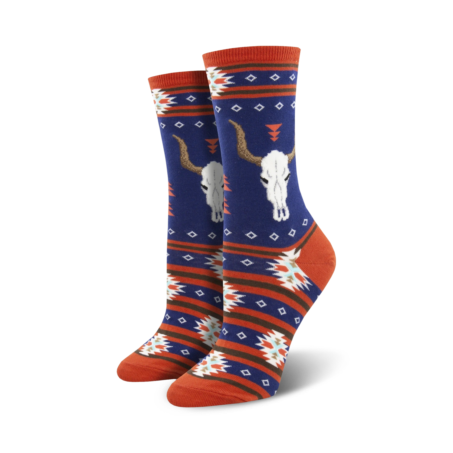 Close-up view of a pair of navy blue and orange crew socks with the same longhorn skull and southwestern pattern design.