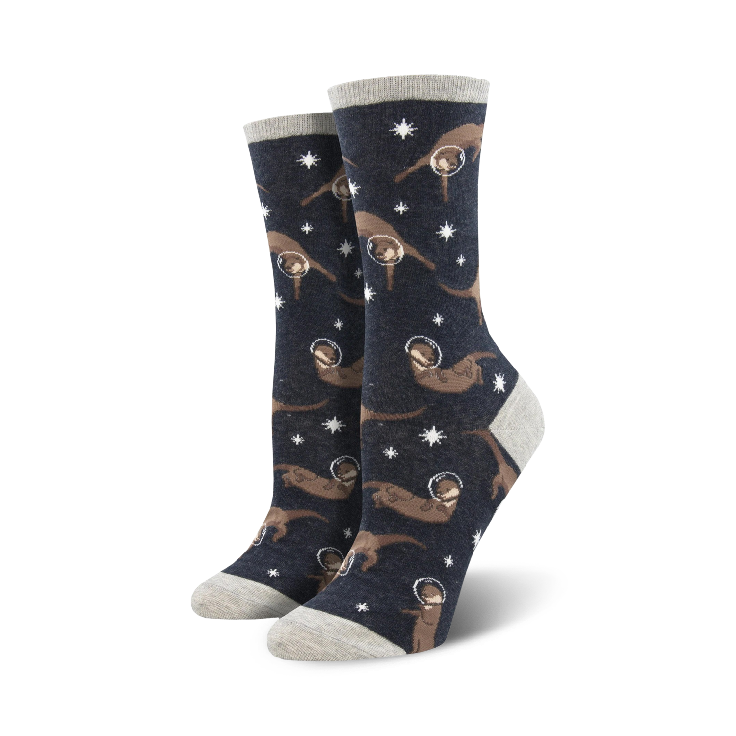 Lifestyle shot showing the 'Otter Space' socks on a model's feet. The socks are dark grey with brown otters in space helmets against a background of stars.