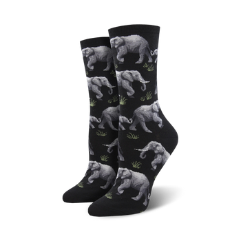 black elephant crew socks feature a line of gray elephants walking between green patches of grass.  