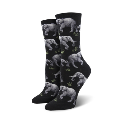 black elephant crew socks feature a line of gray elephants walking between green patches of grass.  