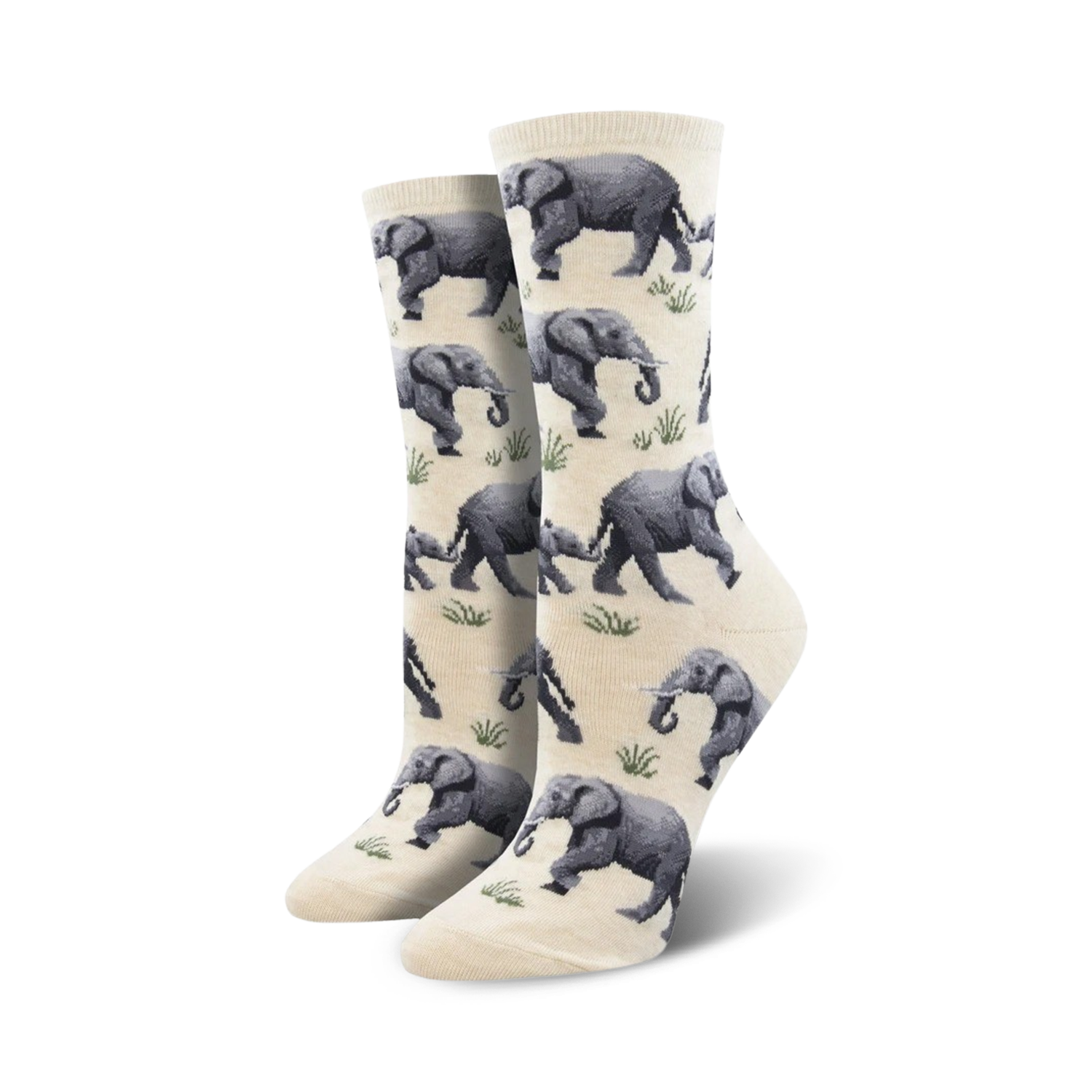 Close-up view of a pair of cream-colored crew socks with a repeating pattern of gray elephants and green grass.