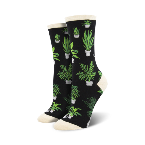 Lifestyle shot of woman wearing the cream Home Grown socks with brown clogs in a garden setting.