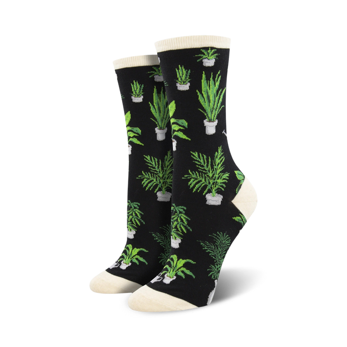 black crew socks with a pattern of green houseplants in pots.  
