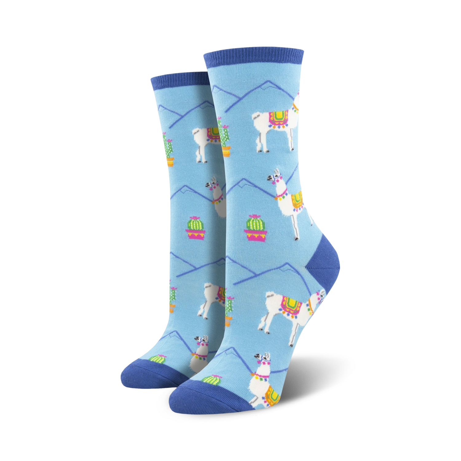 Pair of women's crew socks in light blue. Features a repeating pattern of white llamas with colorful saddles, cacti in pink pots, and light blue mountains.