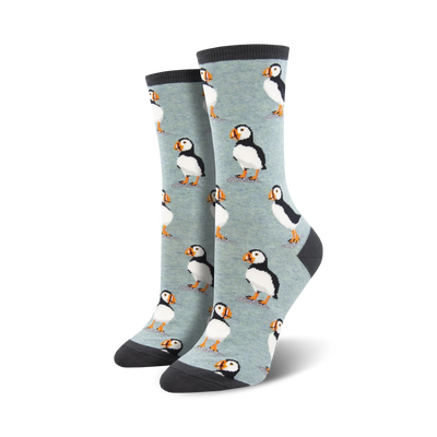 womens crew socks mid-calf length with eight black & white puffins on light blue background   