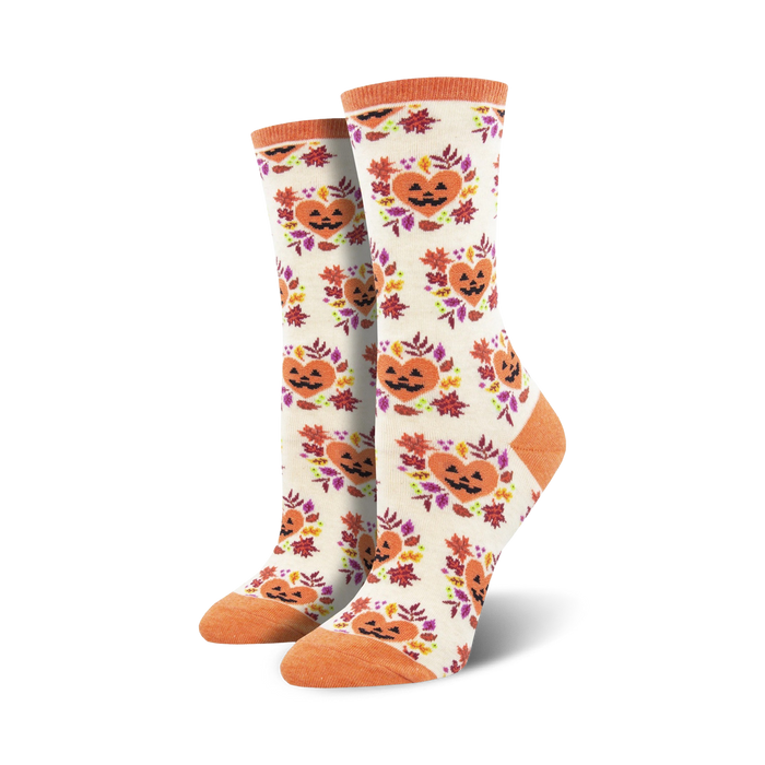 (maximum 140 character seo alt-text):  women's crew socks designed for halloween with an allover bright orange pumpkin with black stem and heart pattern with red leaves and green leaf stems.  