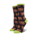 A pair of black crew socks with the same jack-o'-lantern design, but on a black background with lime green cuffs.