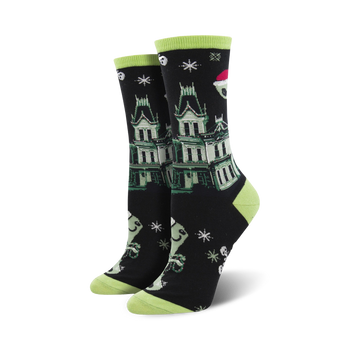 black crew socks with white snowflakes, green & white ghosts, and a haunted house, perfect for halloween.   
