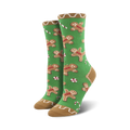 Pair of crew socks with a festive design. Green background with gingerbread men and candy canes. Tan cuff.