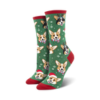 Pair of crew socks; green background with festive Corgis wearing Santa hats and reindeer antlers; snowflakes for a holiday feel.