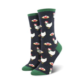 women's dark blue crew socks featuring a pattern of white chickens wearing santa hats and green ribbons. christmas-themed.   