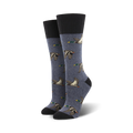Pair of women's crew socks in blue wool blend. Features a repeating pattern of flying mallard ducks in shades of brown and green.