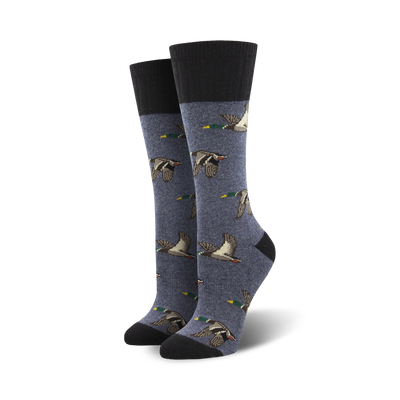 dark blue crew socks feature a pattern of flying brown and teal ducks.  