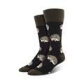 Pair of crew socks with a dark background and a repeating pattern of cute hedgehogs.  The socks are primarily dark grey/black with beige hedgehog details and olive green cuffs.