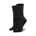 Pair of black crew socks with a grey repeating print of Martin Luther King Jr.'s 'I Have A Dream' speech.