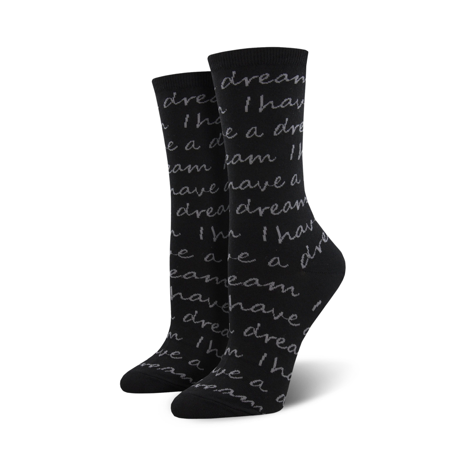 Pair of black crew socks with a grey repeating print of Martin Luther King Jr.'s 'I Have A Dream' speech.