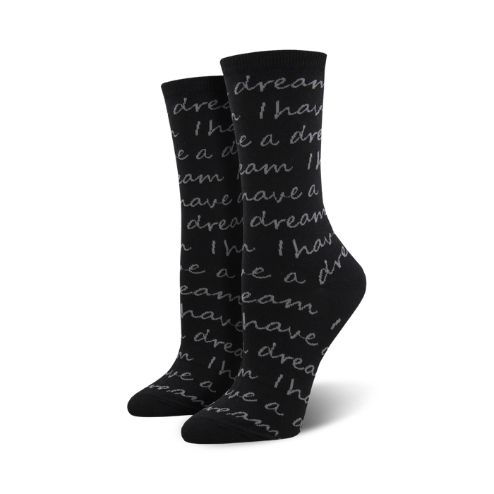 women's crew socks in black with a pattern of light grey text repeating 