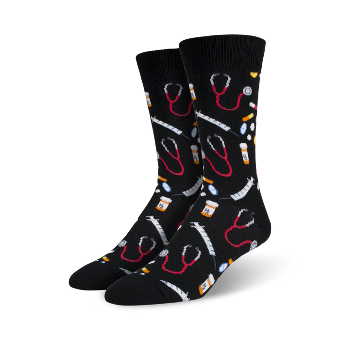 mens medical themed crew socks, black with red and white pills, black stethoscopes, and yellow and red syringes.   }}